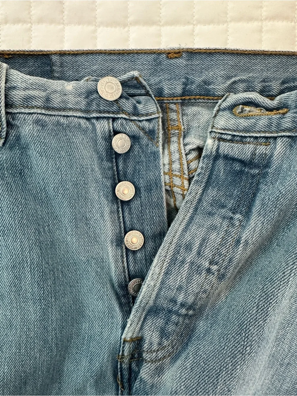 Levi's 501 blue jeans with distressed knees